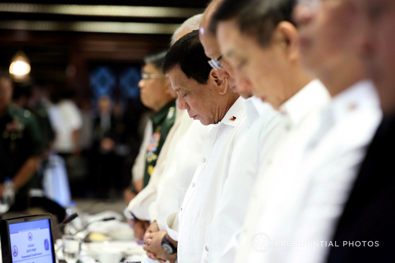 President Rodrigo Roa Duterte bows his head in prayer during the start of the of the Joint Armed Forces of the Philippines (AFP)-Philippine National Police (PNP) Command Conference in Malacañan Palace on November 6, 2017. KARL NORMAN ALONZO/PRESIDENTIAL PHOTO