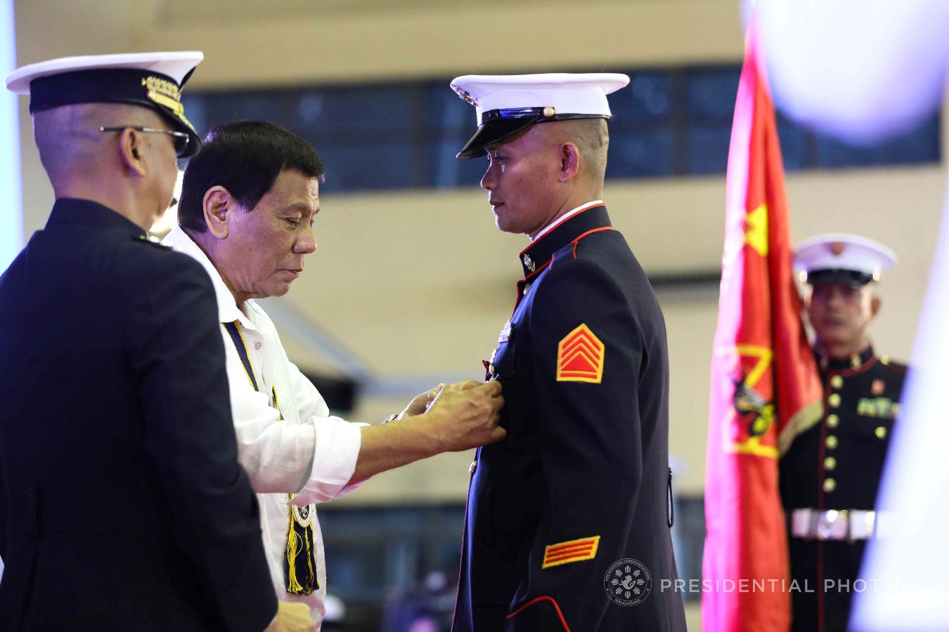 President Rodrigo Roa Duterte confers the Order of Lapu-Lapu Kamagi Medal and the Bronze Cross Medal on SSGt. Antonio Diva during the 67th Birthday celebration of the Philippine Marine Corps at the Bonifacio Naval Station in Fort Bonifacio, Taguig City on November 7, 2017. Diva was hailed for his acts of heroism as member of the 16th Marine Company. ACE MORANDANTE/PRESIDENTIAL PHOTO