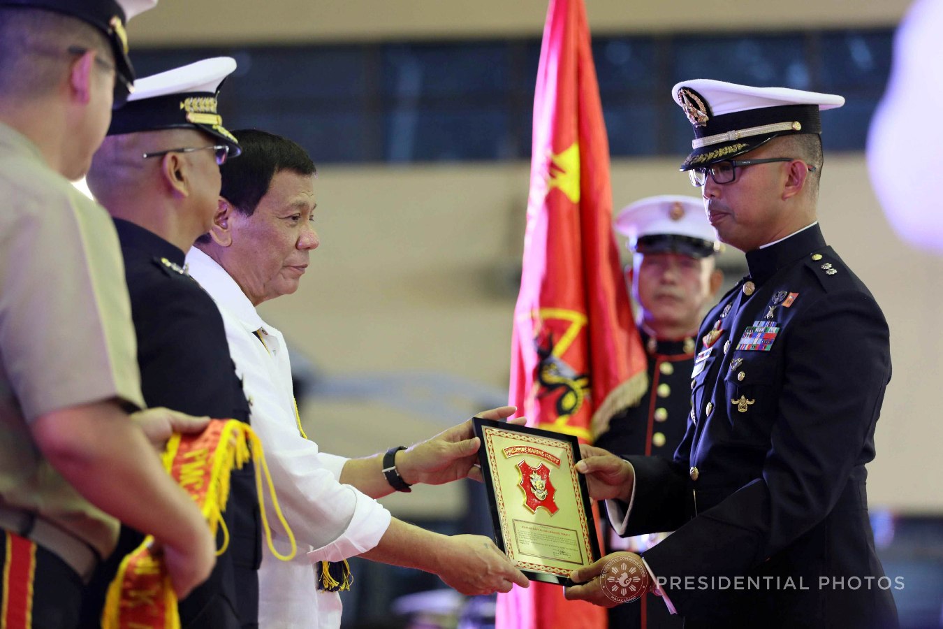 President Rodrigo Roa Duterte confers the Battalion of the Year Award to Lt. Col. Stephen Cabanlet who received the award on behalf of the Marine Battalion Land Team 1 during the 67th Birthday celebration of the Philippine Marine Corps at the Bonifacio Naval Station in Fort Bonifacio, Taguig City on November 7, 2017. ACE MORANDANTE/PRESIDENTIAL PHOTO