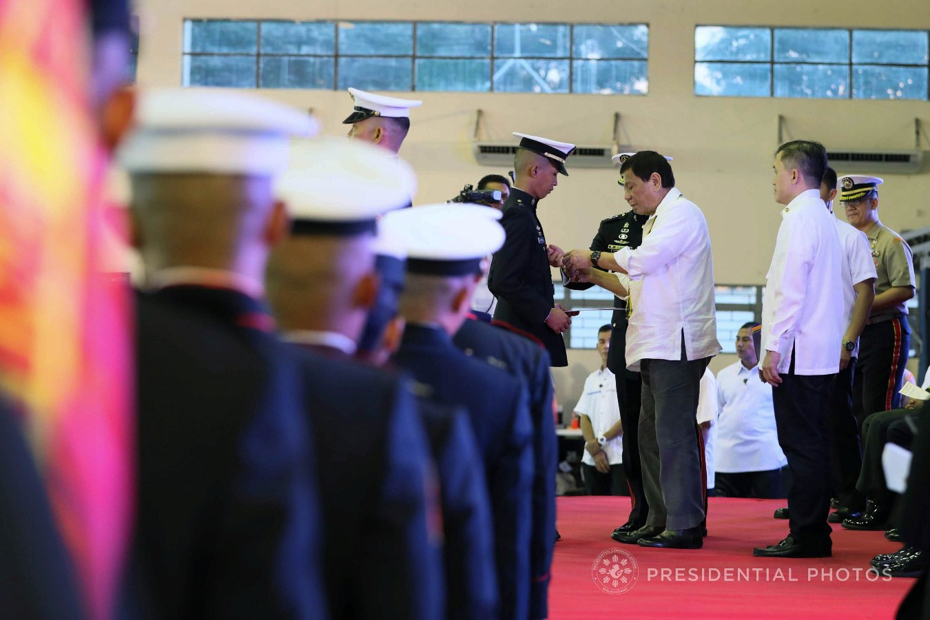President Rodrigo Roa Duterte confers the Order of Lapu-Lapu Kamagi Medal and the Gold Cross Medal on 1Lt. Kim Martal during the 67th Birthday celebration of the Philippine Marine Corps at the Bonifacio Naval Station in Fort Bonifacio, Taguig City on November 7, 2017. Martal was hailed for his gallantry during a battle against the terrorists from the Maute Group. ACE MORANDANTE/PRESIDENTIAL PHOTO