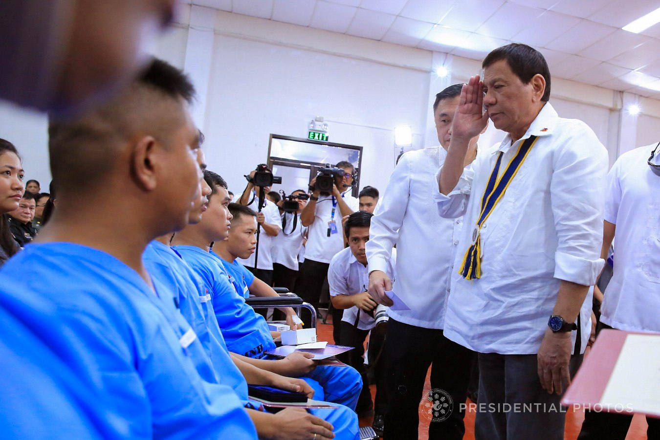 President Rodrigo Roa Duterte salutes to the wounded soldiers who are among the beneficiaries of the Karne, Isda Supply Suporta sa Masa at Ekonomiya (KISS ME) Project during its launching at the Fort Andres Bonifacio in Taguig City on November 7, 2017. ALBERT ALCAIN/PRESIDENTIAL PHOTO