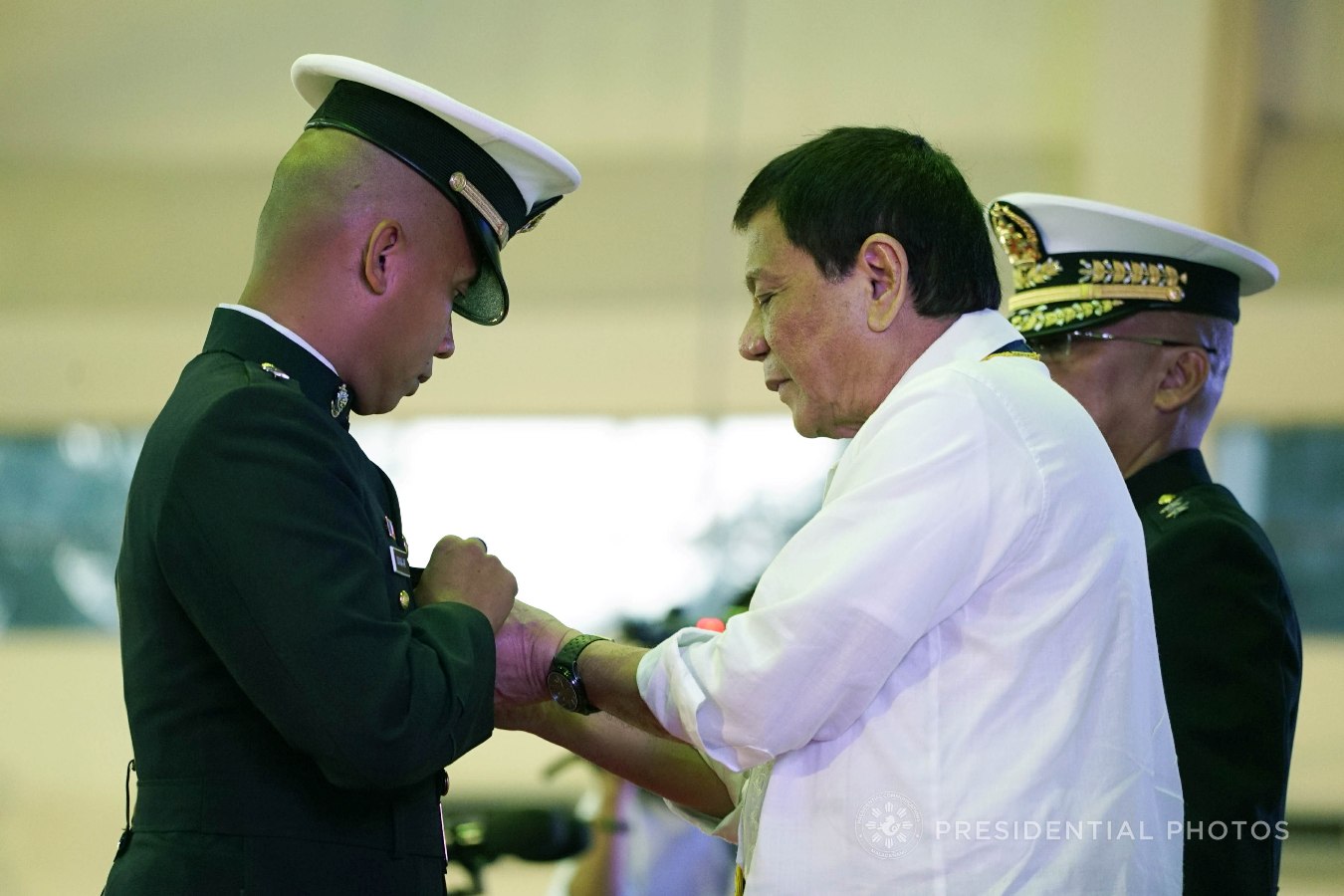 President Rodrigo Roa Duterte confers the Order of Lapu-Lapu Kamagi Medal and the Bronze Cross Medal on 1Lt. Noel Mana-ay during the 67th Birthday celebration of the Philippine Marine Corps at the Bonifacio Naval Station in Fort Bonifacio, Taguig City on November 7, 2017. Mana-ay was hailed for his acts of heroism as member of the 16th Marine Company. KING RODRIGUEZ/PRESIDENTIAL PHOTO