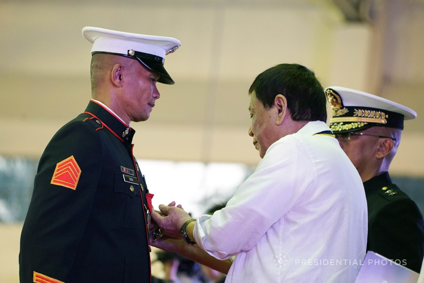 President Rodrigo Roa Duterte confers the Order of Lapu-Lapu Kamagi Medal and the Bronze Cross Medal on SSGt. Antonio Diva during the 67th Birthday celebration of the Philippine Marine Corps at the Bonifacio Naval Station in Fort Bonifacio, Taguig City on November 7, 2017. Diva was hailed for his acts of heroism as member of the 25th Marine Company who fought against terrorists from the Maute Group. KING RODRIGUEZ/PRESIDENTIAL PHOTO