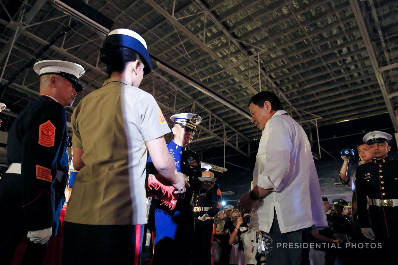President Rodrigo Roa Duterte prepares to taste the Marine birthday cake during the 67th Birthday celebration of the Philippine Marine Corps at the Bonifacio Naval Station in Fort Bonifacio, Taguig City on November 7, 2017. ALBERT ALCAIN/PRESIDENTIAL PHOTO
