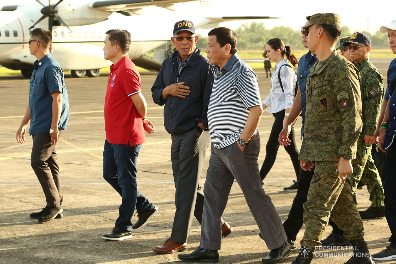 President Rodrigo Roa Duterte is briefed by Defense Secretary Delfin Lorenzana upon his arrival at the Naga Airport on January 4, 2018. The President later held a situation briefing with the members of his cabinet and local government officials at the Camarines Sur Watersports Complex (CWC) in Pili, Camarines Sur to discuss disaster response measures in the aftermath of Tropical Depression (TD) 'Usman'. REY BANIQUET/PRESIDENTIAL PHOTO