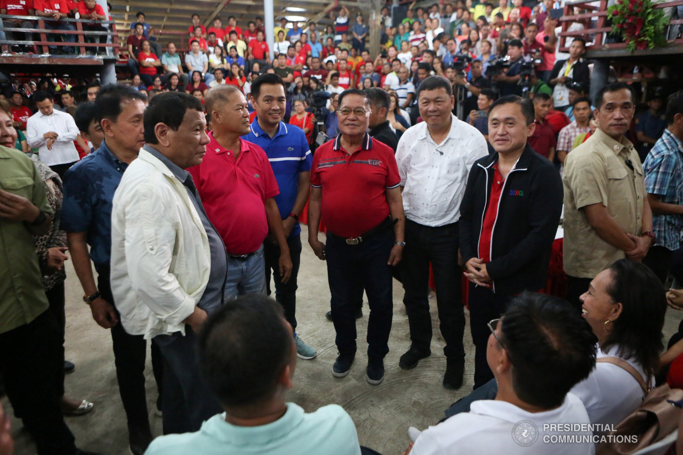 President Rodrigo Roa Duterte gets into a huddle with Masbate Governor Antonio Kho and other invited guests during the Governor's birthday celebration at the Kalasangan Farm in Cataingan, Masbate on January 9, 2019. Among the invited guests were Former Special Assistant to the President Christopher Lawrence "Bong" Go. ALBERT ALCAIN/PRESIDENTIAL PHOTO