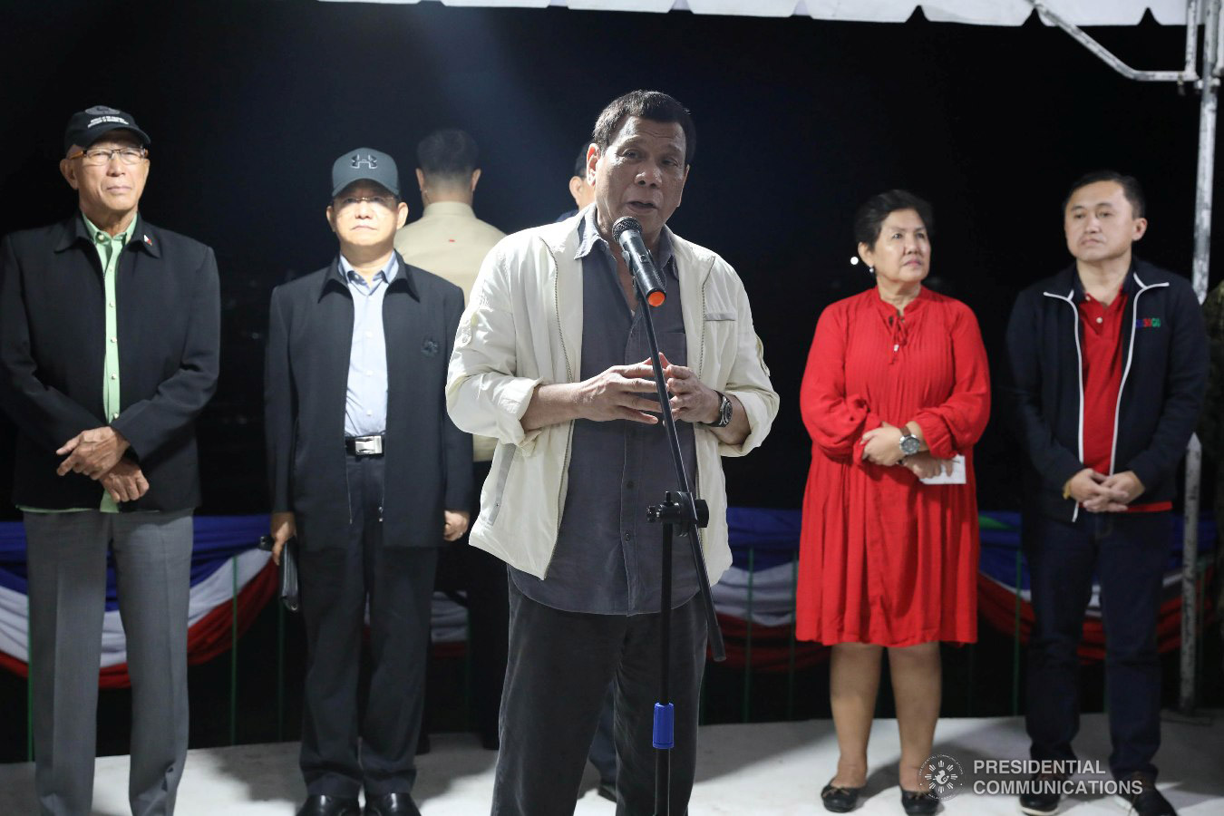 President Rodrigo Roa Duterte addresses newly surrendered former New People's Army rebels at the Cataingan National High School in Cataingan, Masbate on January 9, 2019. Also in the photo are Defense Secretary Delfin Lorenzana, Interior and Local Government Secretary Eduardo Año, and former Special Assistant to the President Christopher Lawrence "Bong" Go. ACE MORANDANTE/PRESIDENTIAL PHOTO