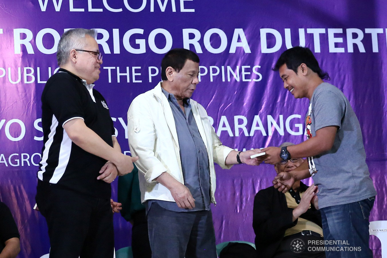 President Rodrigo Roa Duterte awards checks for loan beneficiaries during the Negosyo Serbisyo sa Barangay held at the Patio Milagros Minitel and Resort in Dimasalang, Masbate on January 9, 2019. Assisting the President is Trade and Industry Secretary Ramon Lopez. VALERIE ESCALERA/PRESIDENTIAL PHOTO