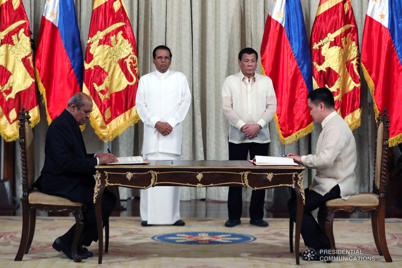 President Rodrigo Roa Duterte and Democratic Socialist Republic of Sri Lanka President Maithripala Sirisena witness the signing of agreements between Sri Lankan Minister of Foreign Affairs Tilak Marapana and Agriculture Undersecretary Waldo Carpio at the Malacañan Palace on January 16, 2019. The agreement is a Memorandum of Understanding on Cooperation in Agriculture, Fisheries and Related Fields between the Republic of the Philippines and the Democratic Socialist Republic of Sri Lanka ACE MORANDANTE/PRESIDENTIAL PHOTO
