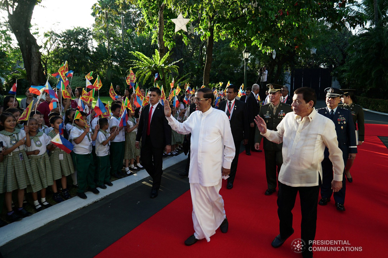 President Rodrigo Roa Duterte and Democratic Socialist Republic of Sri Lanka President Maithripala Sirisena wave to some elementary school school students as they waved the flags of Sri Lanka and the Philippines during the welcome ceremony for the Sri Lankan President at the Malacañan Palace on January 16, 2019. KING RODRIGUEZ/PRESIDENTIAL PHOTO