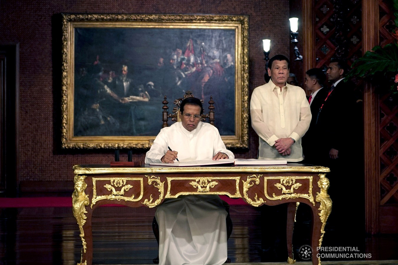 President Rodrigo Roa Duterte accompanies Democratic Socialist Republic of Sri Lanka President Maithripala Sirisena as the latter signs the official Palace guest book upon his arrival at the Malacañan Palace on January 16, 2019. KING RODRIGUEZ/PRESIDENTIAL PHOTO