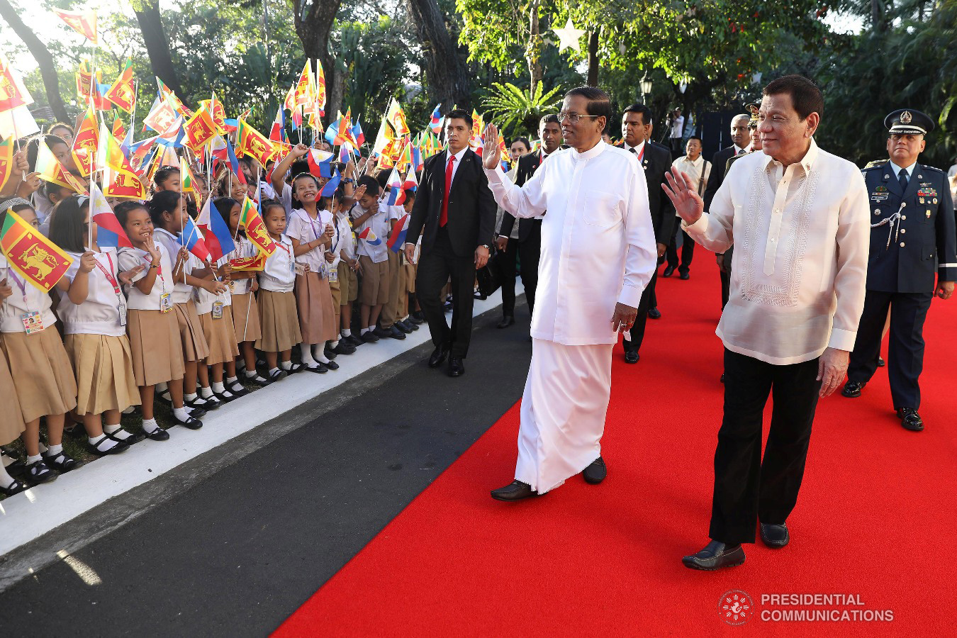 President Rodrigo Roa Duterte and Democratic Socialist Republic of Sri Lanka President Maithripala Sirisena wave to some elementary school school students as they waved the flags of Sri Lanka and the Philippines during the welcome ceremony for the Sri Lankan President at the Malacañan Palace on January 16, 2019. KING RODRIGUEZ/PRESIDENTIAL PHOTO