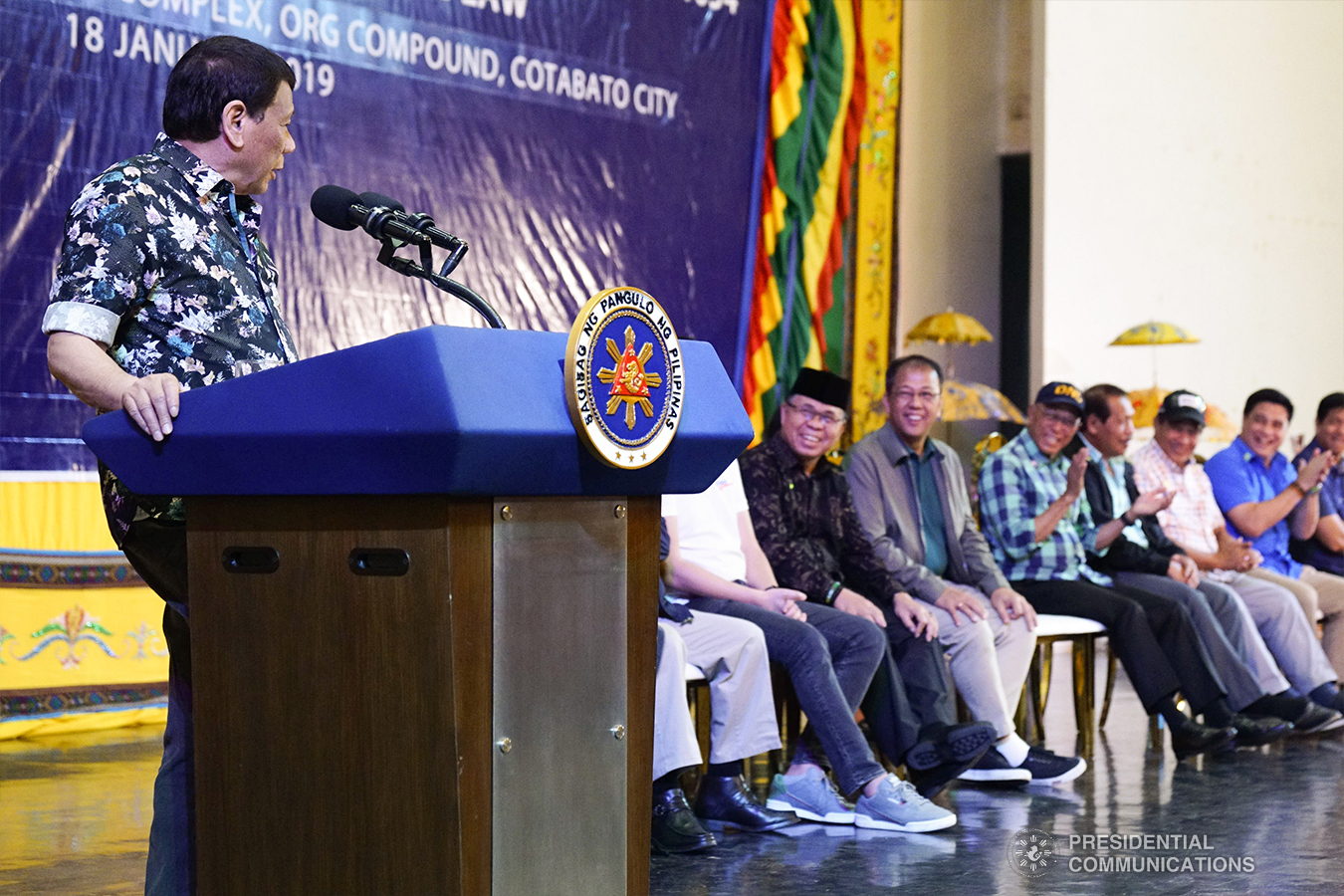 President Rodrigo Roa Duterte shares a light moment with distinguished guests while delivering his speech during the Peace Assembly for the Ratification of Republic Act No. 11054 or the Bangsamoro Organic Law (BOL), held at the Shariff Kabunsuan Cultural Complex Compound in Cotabato City on January 18, 2019. ARMAN BAYLON/PRESIDENTIAL PHOTO