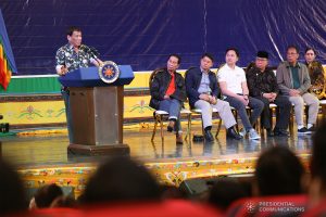 President Rodrigo Roa Duterte delivers his speech during the Peace Assembly for the Ratification of Republic Act No. 11054 or the Bangsamoro Organic Law (BOL), held at the Shariff Kabunsuan Cultural Complex in Cotabato City on January 18, 2019. Joining the President on stage are Presidential Spokesperson and Chief Legal Counsel Salvador Panelo, Interior and Local Government Secretary Eduardo Año, Cabinet Secretary Karlo Nograles, Moro Islamic Liberation Front Chairman Al-Hajj Murad Ebrahim, and Presidential Adviser on the Peace Process Carlito Galvez Jr. ROBINSON NIÑAL JR./PRESIDENTIAL PHOTO