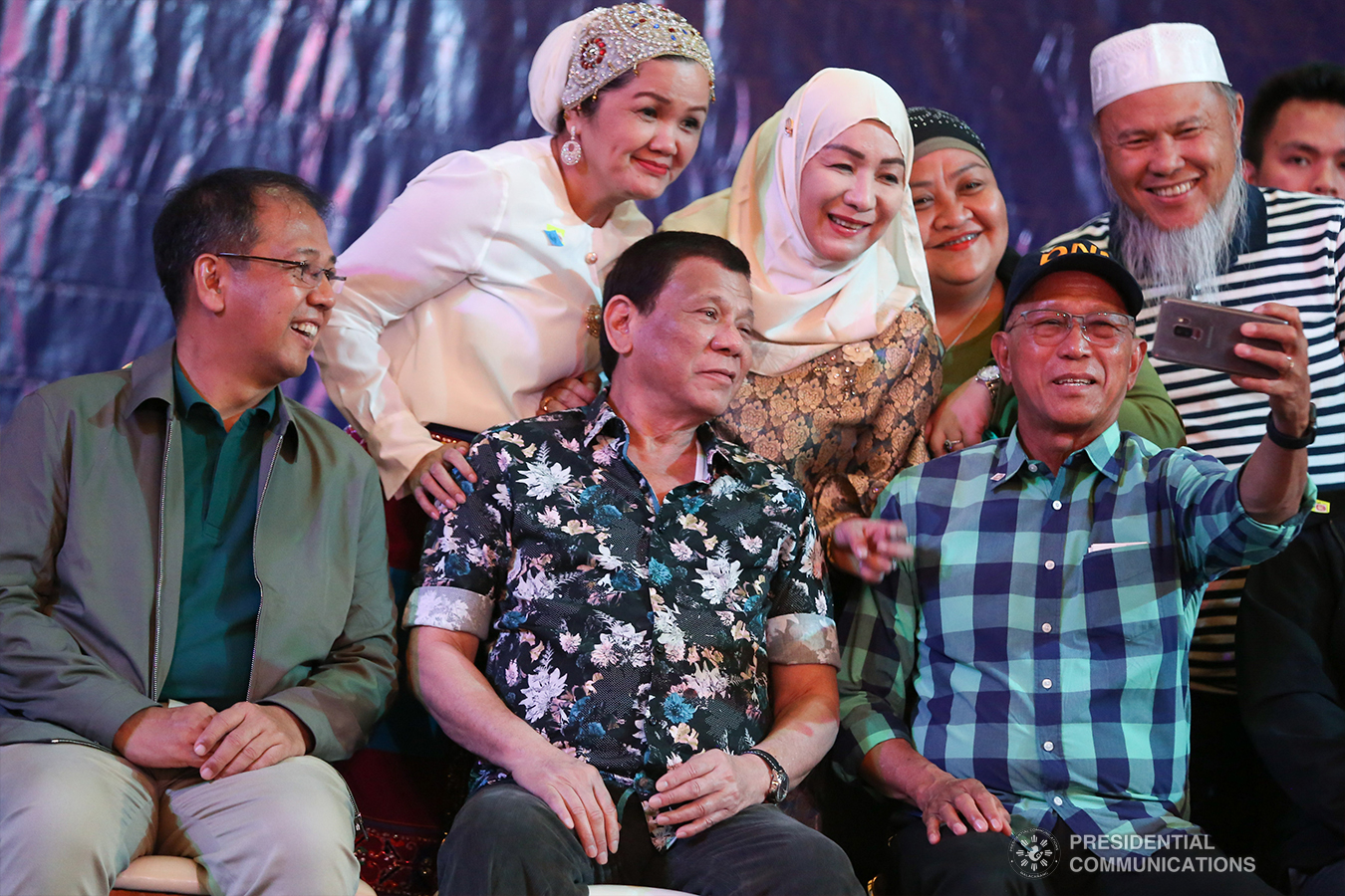 President Rodrigo Roa Duterte poses for a groufie with Presidential Adviser on the Peace Process Carlito Galvez Jr., Defense Secretary Delfin Lorenzana, and some guests during the Peace Assembly for the Ratification of Republic Act No. 11054 or the Bangsamoro Organic Law (BOL), held at the Shariff Kabunsuan Cultural Complex in Cotabato City on January 18, 2019. ROBINSON NIÑAL JR./PRESIDENTIAL PHOTO
