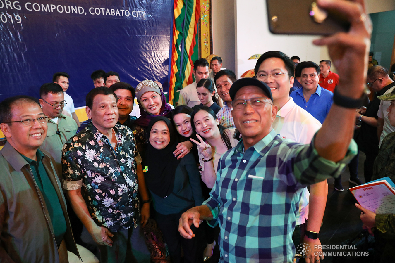 President Rodrigo Roa Duterte poses for a groufie with Presidential Adviser on the Peace Process Carlito Galvez Jr., National Security Adviser Hermogenes Esperon Jr., Defense Secretary Delfin Lorenzana, Cabinet Secretary Karlo Nograles, and some guests during the Peace Assembly for the Ratification of Republic Act No. 11054 or the Bangsamoro Organic Law (BOL), held at the Shariff Kabunsuan Cultural Complex in Cotabato City on January 18, 2019. ROBINSON NIÑAL JR./PRESIDENTIAL PHOTO