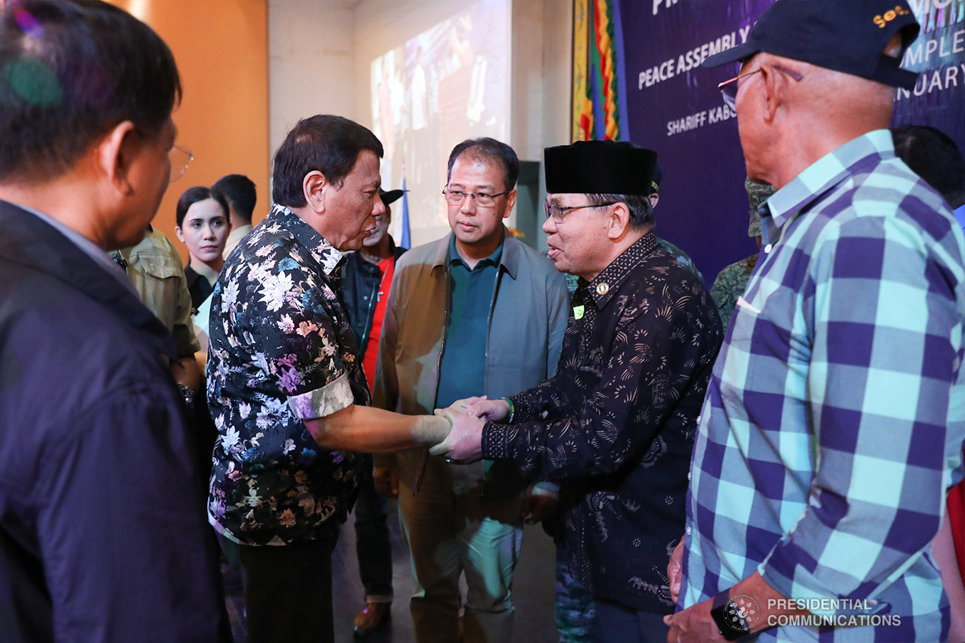 President Rodrigo Roa Duterte shares a light moment with Interior and Local Government Secretary Eduardo Año, Former Special Assistant to the President Christopher Lawrence "Bong" Go, Autonomous Region in Muslim Mindanao (ARMM) Governor Mujiv Hataman, Senator Juan Miguel Zubiri, Social Welfare and Development Secretary Rolando Bautista, and Cabinet Secretary Karlo Nograles at the sidelines of the Peace Assembly for the Ratification of Republic Act No. 11054 or the Bangsamoro Organic Law (BOL), held at the Shariff Kabunsuan Cultural Complex in Cotabato City on January 18, 2019. ROBINSON NIÑAL JR./PRESIDENTIAL PHOTO