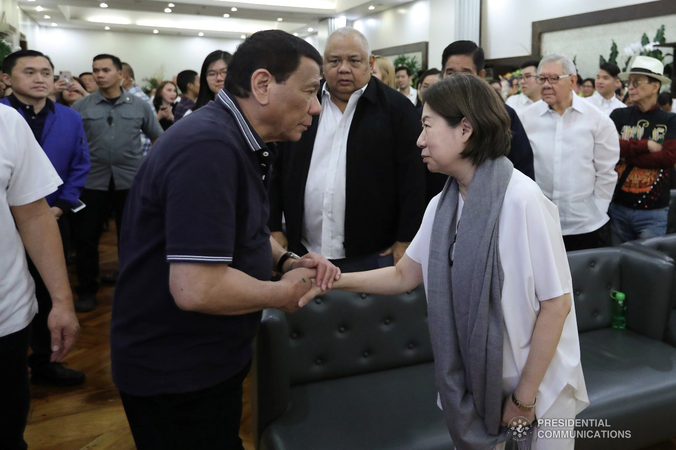 President Rodrigo Roa Duterte condoles with Teresita Sy-Coson, daughter of  the late Chinese-Filipino business magnate Henry Sy, as he visits the wake at the Heritage Memorial Park in Taguig City on January 20, 2019. VALERIE ESCALERA/ PRESIDENTIAL PHOTO