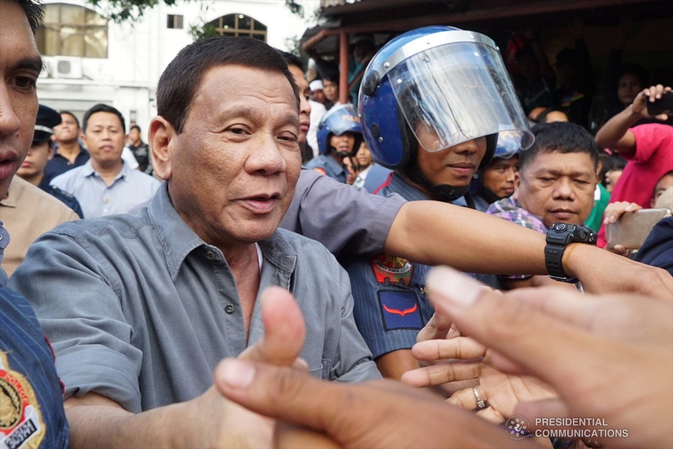 President Rodrigo Roa Duterte mingles with his adoring supporters at the sidelines of the annual assembly of the Provincial Union of Leaders Against Illegality (PULI) at the Quezon Convention Center in Lucena City, province of Quezon on January 22, 2019. RENE LUMAWAG/PRESIDENTIAL PHOTO