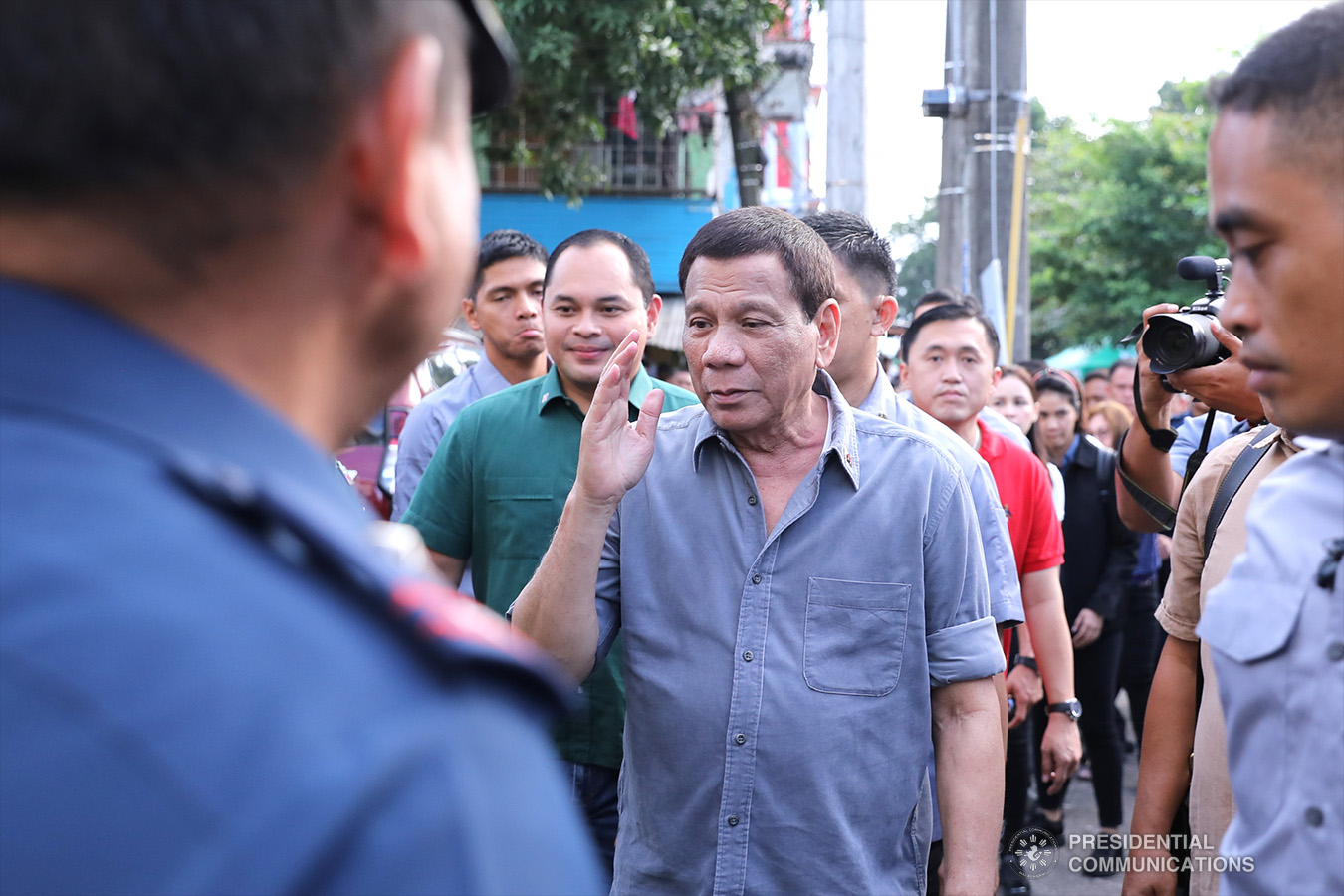 President Rodrigo Roa Duterte salutes in response to police officials who welcomed him at his arrival at the Quezon Convention Center in Lucena City, province of Quezon on his way to the annual assembly of the Provincial Union of Leaders Against Illegality (PULI) on January 22, 2019. VALERIE ESCALERA/PRESIDENTIAL PHOTO