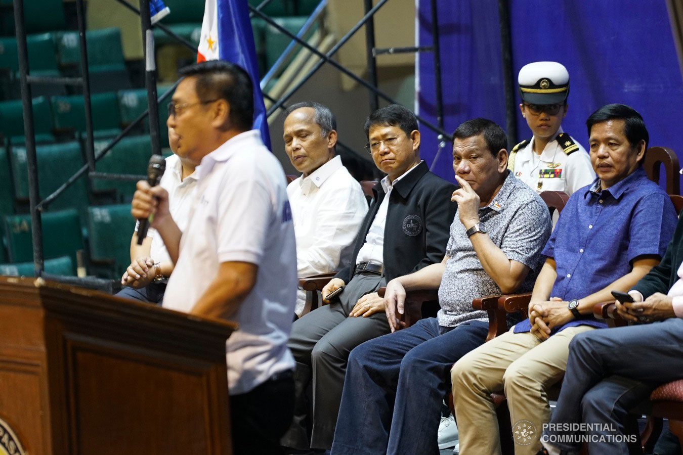 President Rodrigo Roa Duterte listens attentively to NCR TODA Coalition President Ace Sevilla, as the latter gives his message during the Tricycle Operators and Drivers’ Association (TODA) Summit at the Cuneta Astrodome in Pasay City on January 23, 2019. Also in the photo are Energy Secretary Alfonso Cusi, Interior and Local Government Secretary Eduardo Año and Social, and Welfare Development Secretary Rolando Bautista. KING RODRIGUEZ/PRESIDENTIAL PHOTO