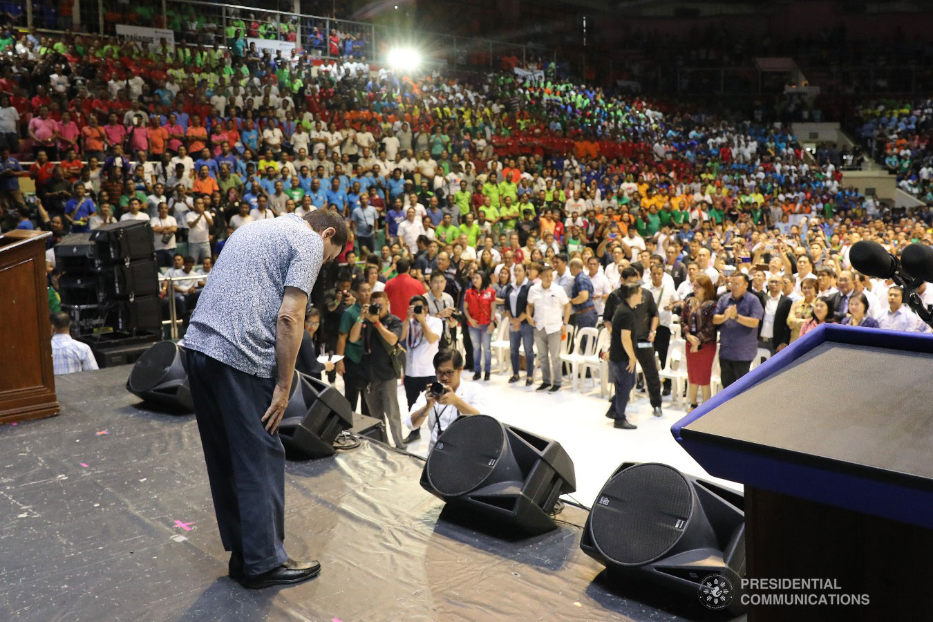President Rodrigo Roa Duterte bows before a jampacked crowd during the Tricycle Operators and Drivers’ Association (TODA) Summit at the Cuneta Astrodome in Pasay City on January 23, 2019. REY BANIQUET/PRESIDENTIAL PHOTO