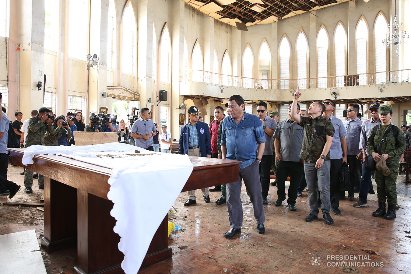 President Rodrigo Roa Duterte conducts an inspection inside the Cathedral of Our Lady of Mount Carmel in Jolo, Sulu on January 28, 2019 where two explosions occurred inside and outside the church last January 27. ALBERT ALCAIN/PRESIDENTIAL PHOTO