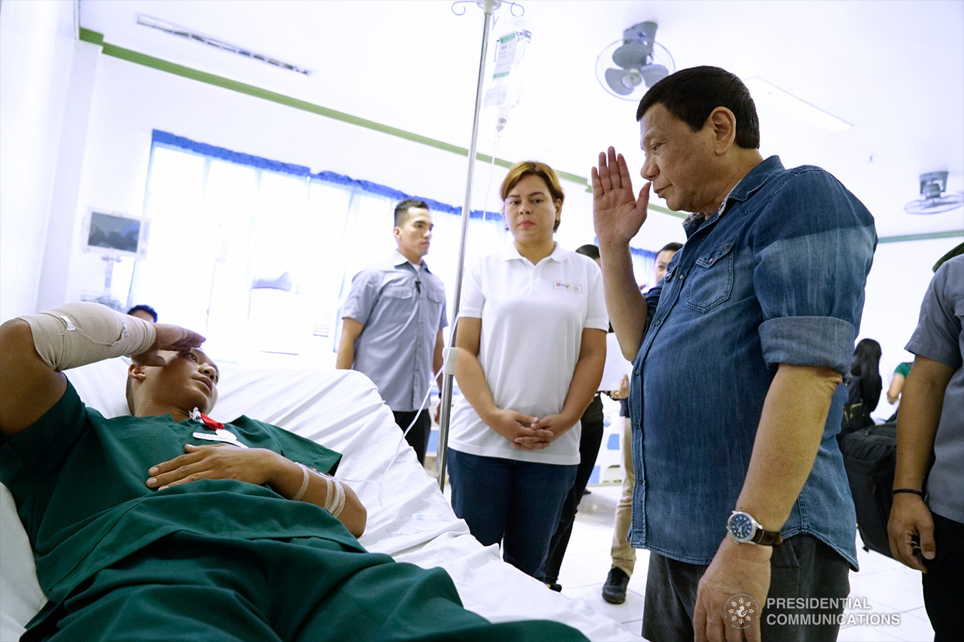 President Rodrigo Roa Duterte salutes one of the wounded soldiers during his visit to Camp Teodulfo Bautista in Jolo, Sulu on January 28, 2019. The President personally checked the condition of the soldiers who were wounded during the twin bombings at the Cathedral of Our Lady of Mount Carmel in Jolo last January 27. Accompanying the President is his daughter, Davao City Mayor Sara Duterte-Carpio. KING RODRIGUEZ/PRESIDENTIAL PHOTO