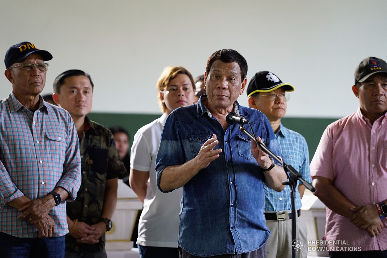 President Rodrigo Roa Duterte offers his condolences to the families of the victims who died during the twin bombings at the Cathedral of Our Lady of Mount Carmel in Jolo, Sulu as he visited Camp Teodulfo Bautista in Jolo on January 28, 2019. Also in the photo are Defense Secretary Delfin Lorenzana, Former Special Assistant to the President Christopher Lawrence "Bong" Go, Davao City Mayor Sara Duterte-Carpio, Interior and Local Government Secretary Eduardo Año, and National Security Adviser Hermogenes Esperon Jr. KING RODRIGUEZ/PRESIDENTIAL PHOTO
