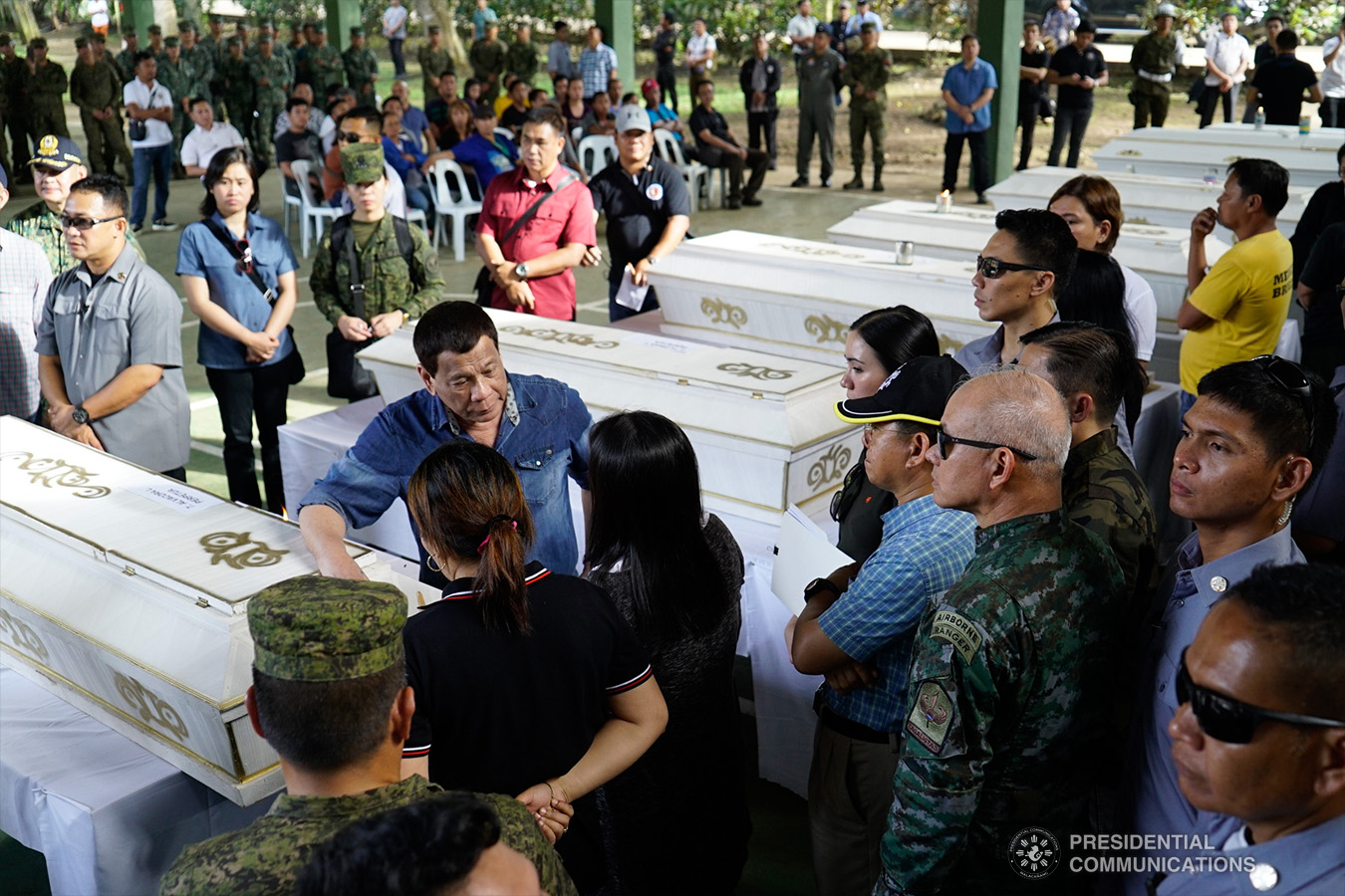 President Rodrigo Roa Duterte commiserates with the relatives of one of the victims who died during the twin bombings at the Cathedral of Our Lady of Mount Carmel in Jolo, Sulu as he visited Camp Teodulfo Bautista in Jolo on January 28, 2019. KING RODRIGUEZ/PRESIDENTIAL PHOTO
