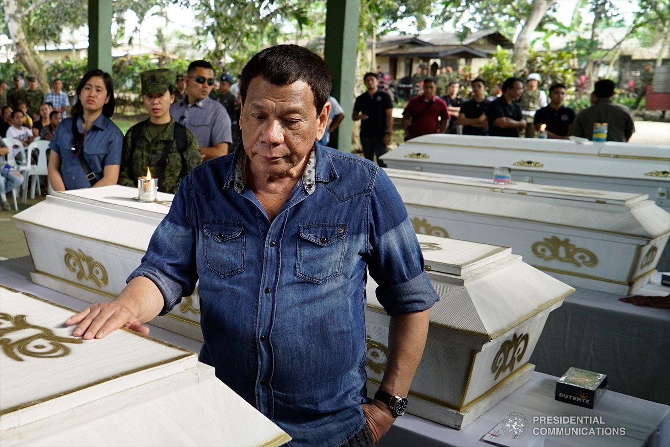 President Rodrigo Roa Duterte pays his last respects to one of the victims who died during the twin bombings at the Cathedral of Our Lady of Mount Carmel in Jolo, Sulu as he visited Camp Teodulfo Bautista in Jolo on January 28, 2019. KING RODRIGUEZ/PRESIDENTIAL PHOTO