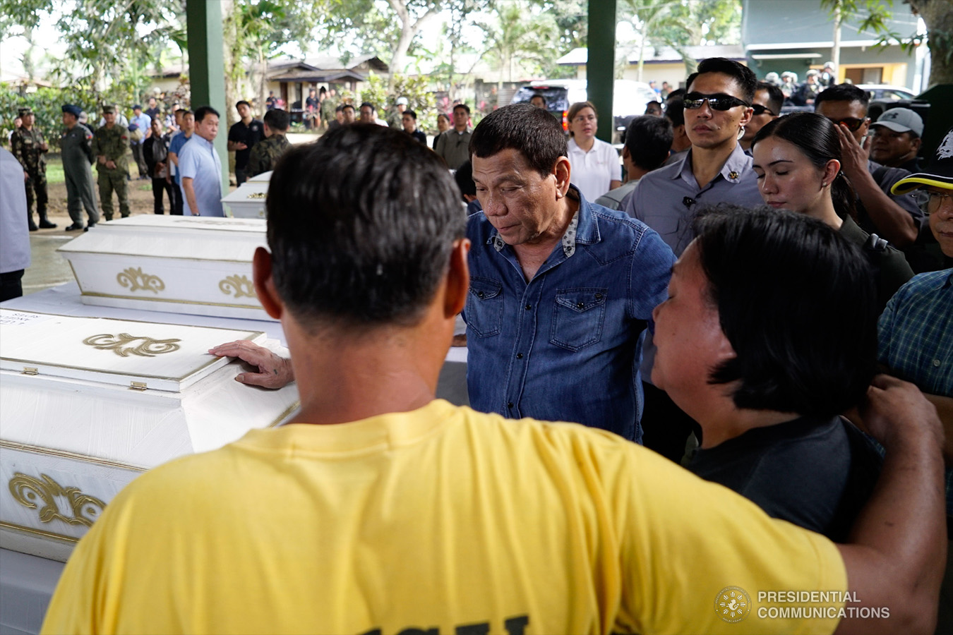 President Rodrigo Roa Duterte commiserates with the relatives of one of the victims who died during the twin bombings at the Cathedral of Our Lady of Mount Carmel in Jolo, Sulu as he visited Camp Teodulfo Bautista in Jolo on January 28, 2019. KING RODRIGUEZ/PRESIDENTIAL PHOTO