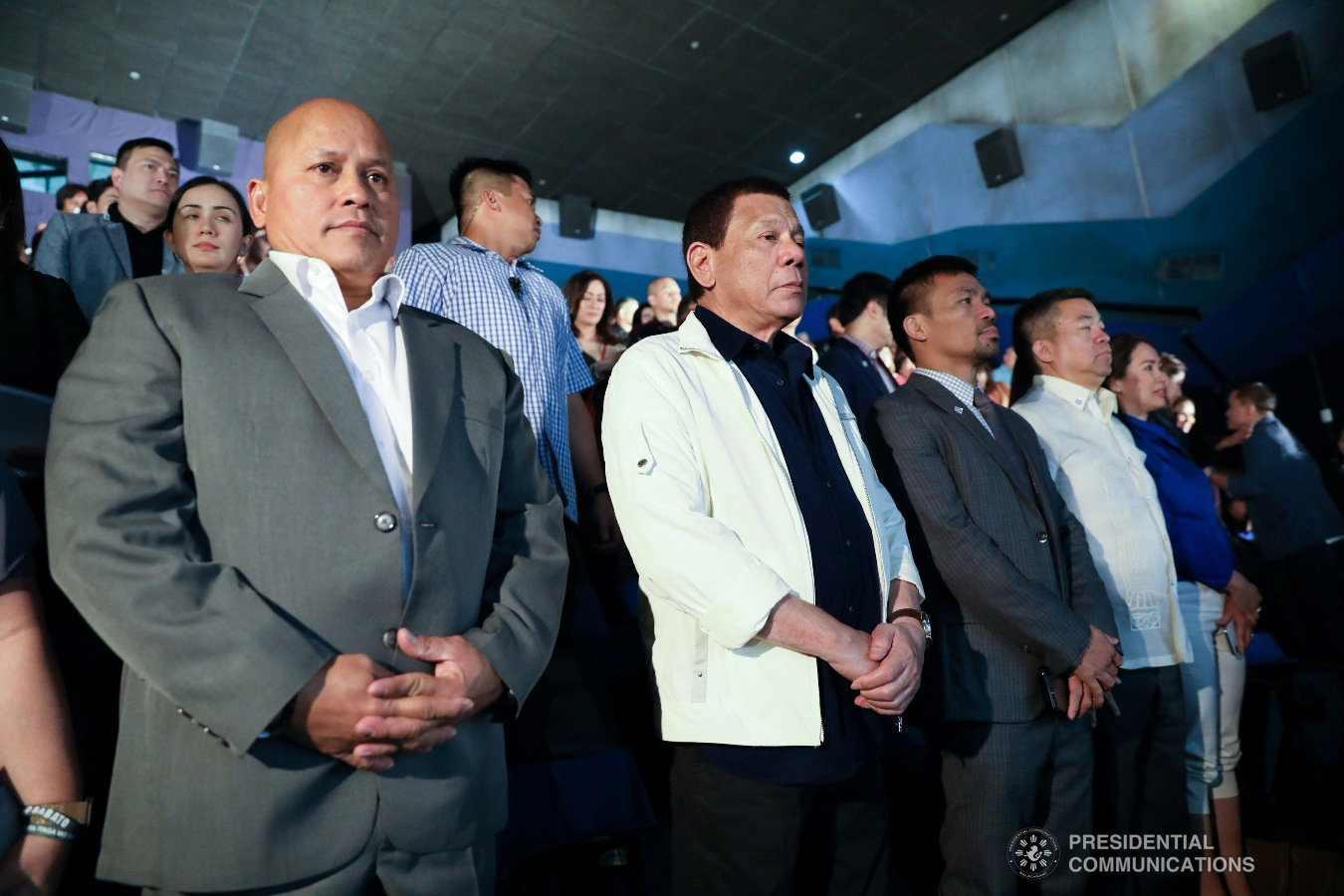 President Rodrigo Roa Duterte settles into his seat beside former PNP chief and BuCor head Ronald Dela Rosa, Senator Manny Pacquiao, and Senator Koko Pimentel as they watch the premiere of the action film "Bato The Movie: The General Ronald Dela Rosa Story" held at Cinema 1 of SM Megamall in Mandaluyong City on January 29, 2019. ACE MORANDANTE/ PRESIDENTIAL PHOTO