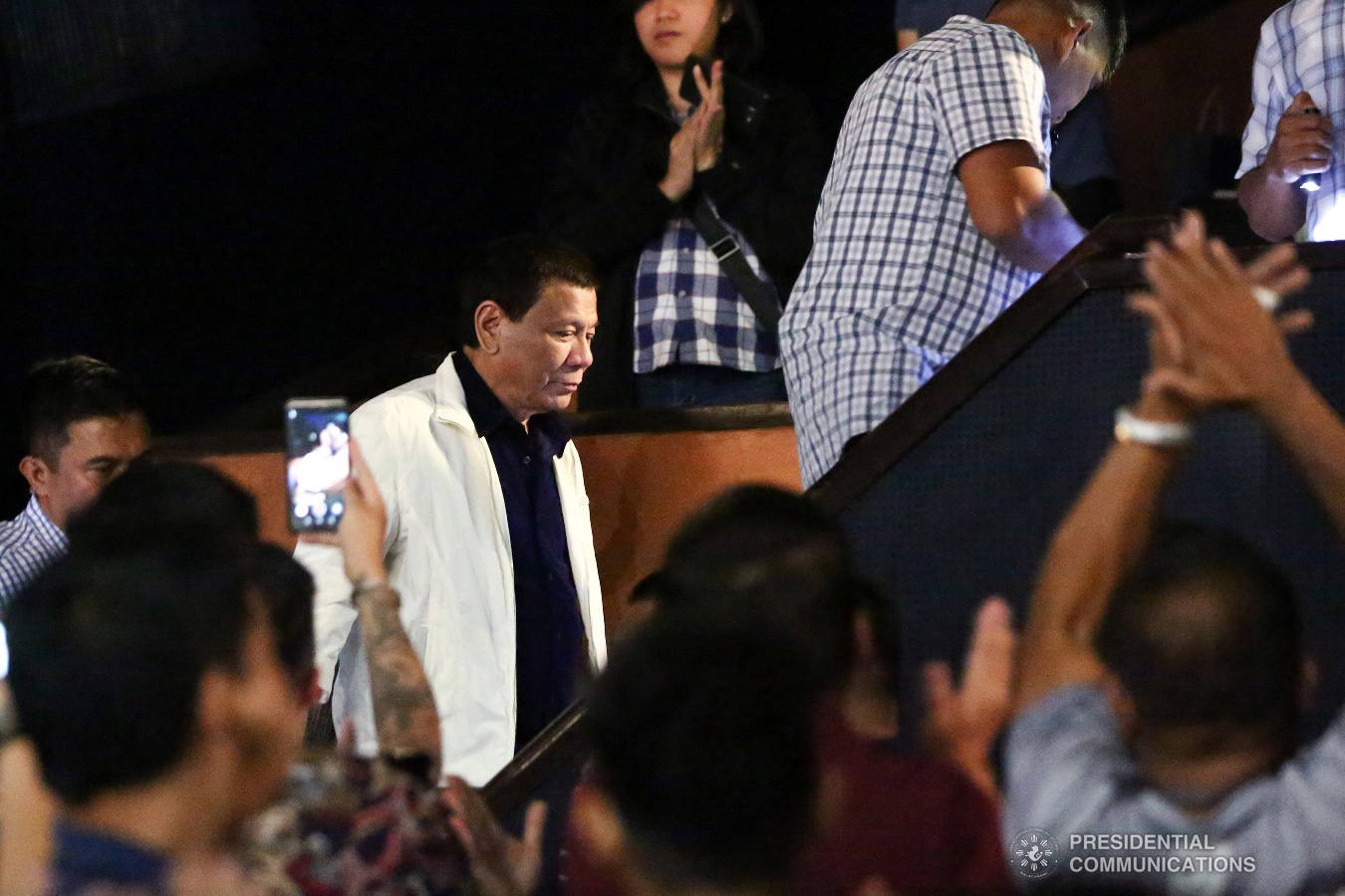 President Rodrigo Roa Duterte receives applause as he is ushered to his seat inside the Cinema 1 of SM Megamall in Mandaluyong City during the premiere night of "Bato The Movie: The General Ronald Dela Rosa Story" on January 29, 2019. ALFRED FRIAS/ PRESIDENTIAL PHOTO