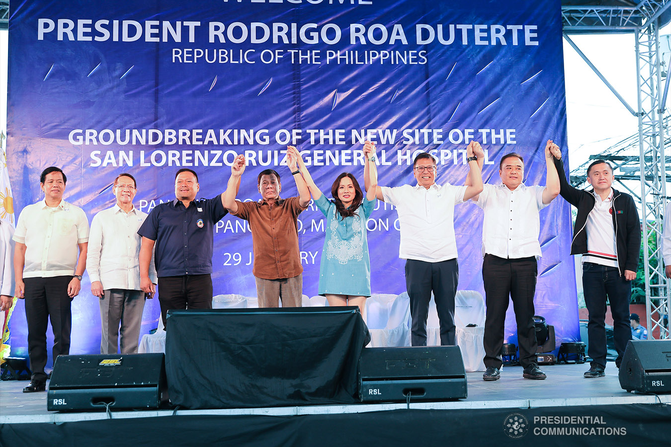 President Rodrigo Roa Duterte raises the hands of Senator Joseph Victor Ejercito, Malabon City Vice Mayor Jeannie Sandoval, Malabon City Representative Federico Sandoval II, and Former Special Assistant to the President Christopher Lawrence "Bong" Go on the sidelines of the groundbreaking ceremony for the construction of the San Lorenzo Ruiz General Hospital (SLRGH) in Malabon City on January 29, 2019. Also in the photo are Social Welfare and Development Secretary Rolando Bautista and Health Secretary Francisco Duque III. REY BANIQUET/PRESIDENTIAL PHOTO