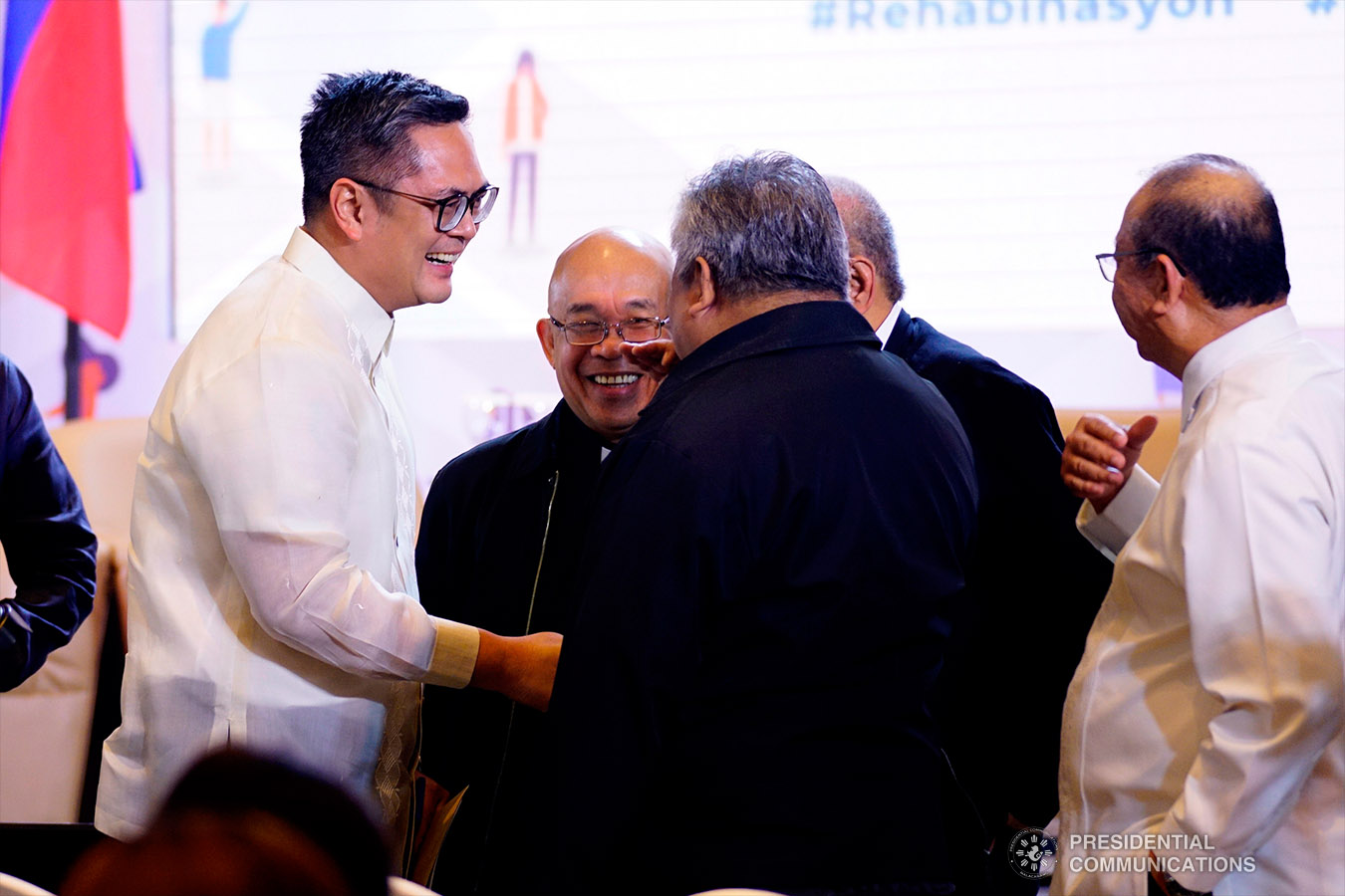 Presidential Communications Operations Office (PCOO) Secretary Martin Andanar flashes President Rodrigo Roa Duterte's signature pose together with PCOO Assistant Secretary Ramon Cualoping III and other staff of the PCOO during the Rehabinasyon: The First National Anti-Drugs Summit held at the Marco Polo Davao in Davao City on February 4, 2019. ARMAN BAYLON/PRESIDENTIAL PHOTO