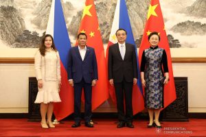 President Rodrigo Roa Duterte and his long-time partner Cielito "Honeylet" Avanceña pose for posterity with People's Republic of China State Council Premier Li Keqiang and his wife Cheng Hong prior to the start of the dinner hosted by the State Council Premier at the Diaoyutai State Guest House in Beijing on April 25, 2019. SIMEON CELI JR./PRESIDENTIAL PHOTO