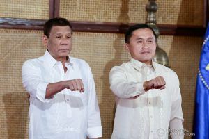 President Rodrigo Roa Duterte strikes his signature pose with Senator Christopher Lawrence "Bong" Go during the latter's oath-taking ceremony at the Malacañan Palace on June 27, 2019. RICHARD MADELO/PRESIDENTIAL PHOTO