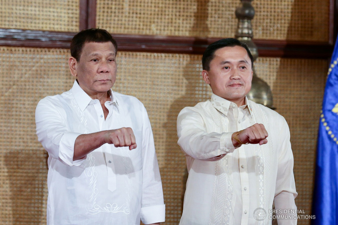 President Rodrigo Roa Duterte strikes his signature pose with Senator Christopher Lawrence "Bong" Go during the latter's oath-taking ceremony at the Malacañan Palace on June 27, 2019. RICHARD MADELO/PRESIDENTIAL PHOTO