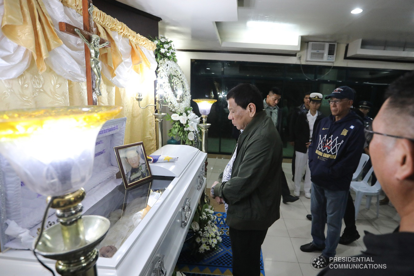 President Rodrigo Roa Duterte pays his last respects to Master Sergeant Ricardo Caacbay as he visits the wake at the Libingan ng mga Bayani Mortuary in Taguig City on June 30, 2019. ALFRED FRIAS/PRESIDENTIAL PHOTO