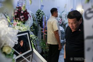 President Rodrigo Roa Duterte pays his last respects to his long-time friend and personal photographer Renato Lumawag at the Cosmopolitan Funeral Chapel in Davao City on July 3, 2019. TOTO LOZANO/PRESIDENTIAL PHOTO