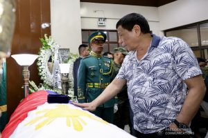 President Rodrigo Roa Duterte pays his last respects to the late Corporal Richard Macabadbad as he visits the wake at the Libingan ng mga Bayani Mortuary in Taguig City on June 30, 2019. RICHARD MADELO/PRESIDENTIAL PHOTO