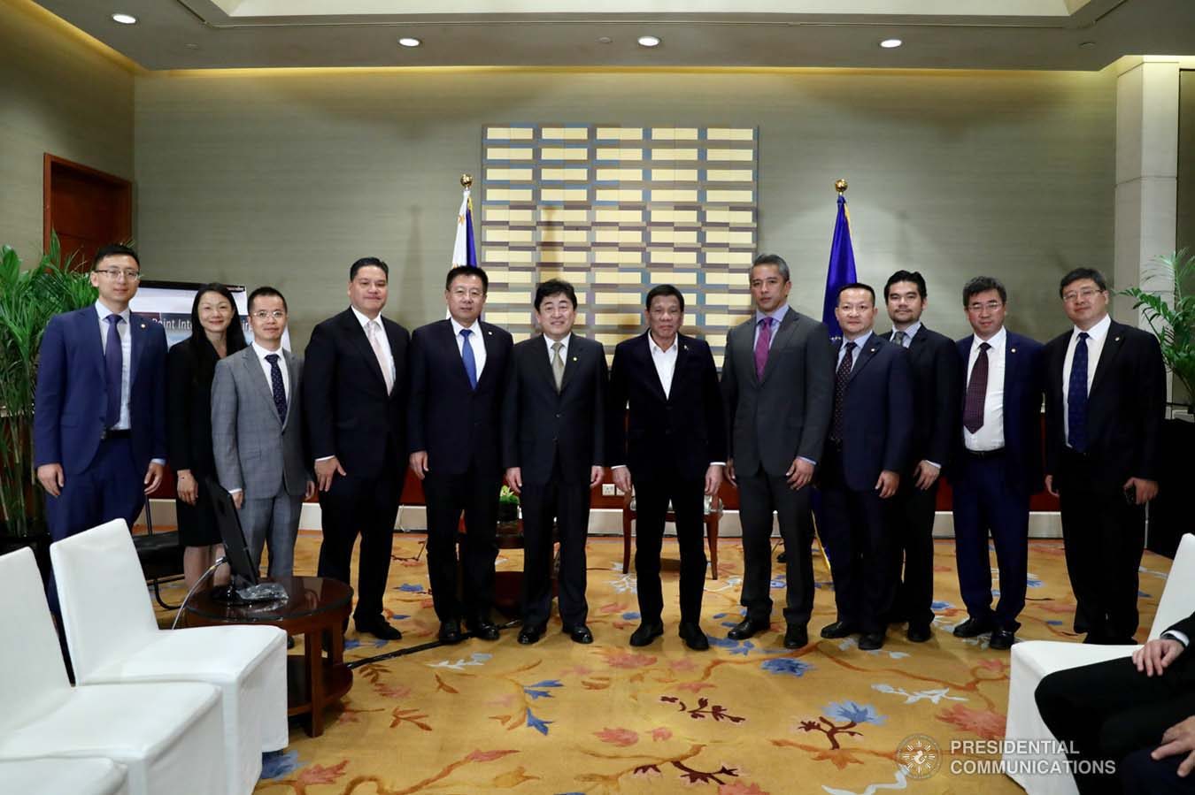 President Rodrigo Roa Duterte grants a photo opportunity to Cavite Governor Juanito Victor Remulla Jr. and officials of CAVITEX Holdings, China Communication Construction Company, and China Airport Construction Group who paid a courtesy call on the President at the Grand Hyatt Hotel in Beijing on August 30, 2019. RICHARD MADELO/ PRESIDENTIAL PHOTO
