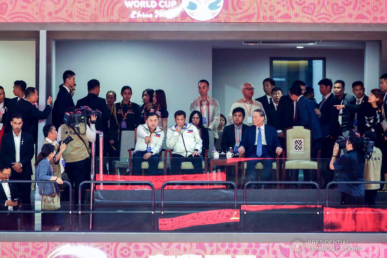 President Rodrigo Roa Duterte shows his support for the Gilas Pilipinas as he watches the Philippines men's national basketball team go up against Italy at the Foshan International Sports and Cultural Center in Guangdong on August 31, 2019. With the President are People's Republic of China Vice President Wang Qishan and Senator Christopher Lawrence Go. VALERIE ESCALERA/ PRESIDENTIAL PHOTO