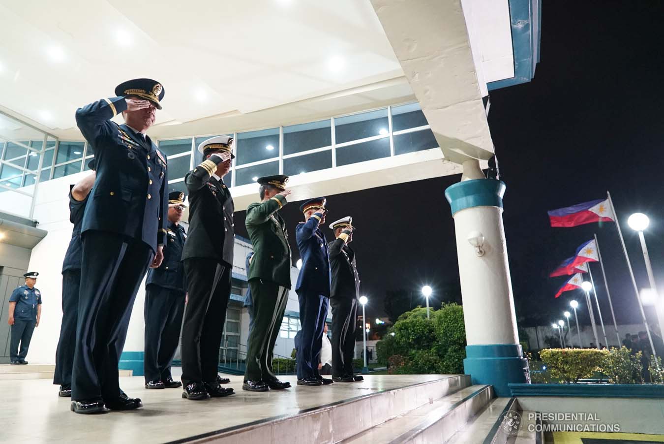 Police and military officers salute President Rodrigo Roa Duterte upon his arrival at the Villamor Air Base in Pasay City on September 1, 2019 following his successful official visit to the People's Republic of China. KING RODRIGUEZ/PRESIDENTIAL PHOTO