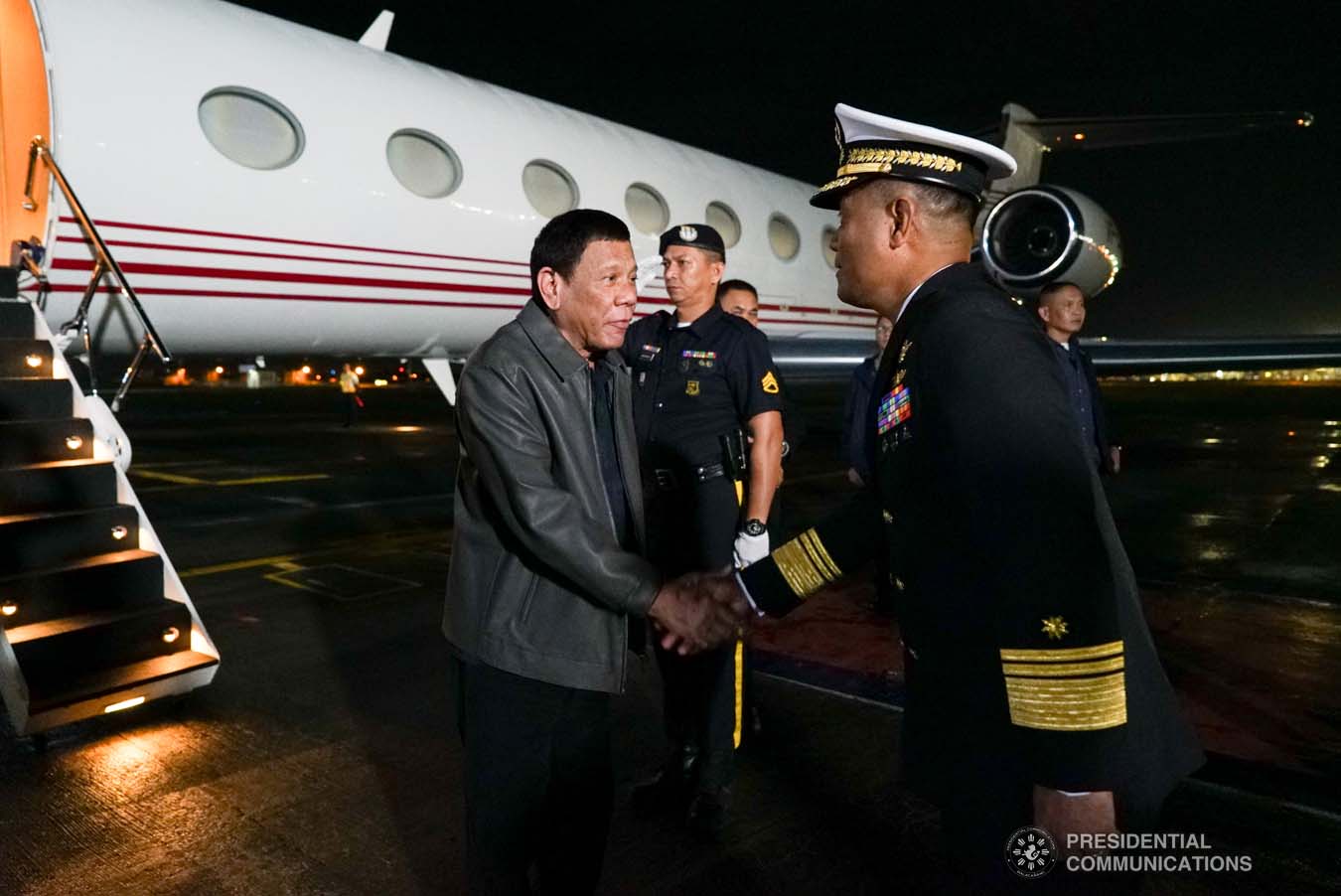 President Rodrigo Roa Duterte is welcomed by a military officer upon his arrival at the Villamor Air Base in Pasay City on September 1, 2019 following his successful official visit to the People's Republic of China. KING RODRIGUEZ/PRESIDENTIAL PHOTO