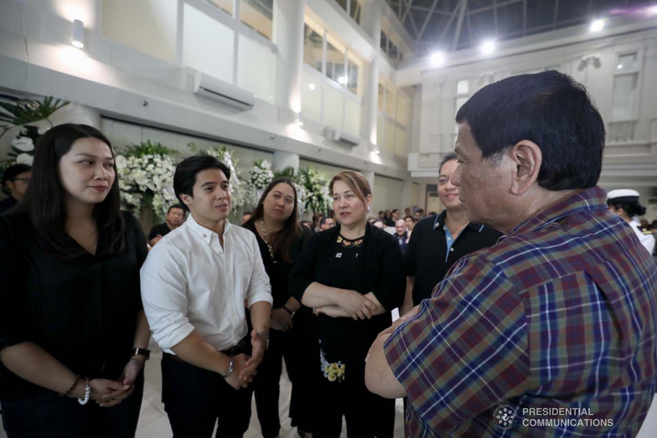 President Rodrigo Roa Duterte commiserates with the family of the late First Officer Lino Cruz III as he visits the wake at the Loyola Memorial Park in Parañaque City on September 5, 2019. Cruz was the co-pilot of the Beechcraft King Air 350 with registry number RP-C2296 that crashed in Calamba City, Laguna last September 1. ACE MORANDANTE/PRESIDENTIAL PHOTO