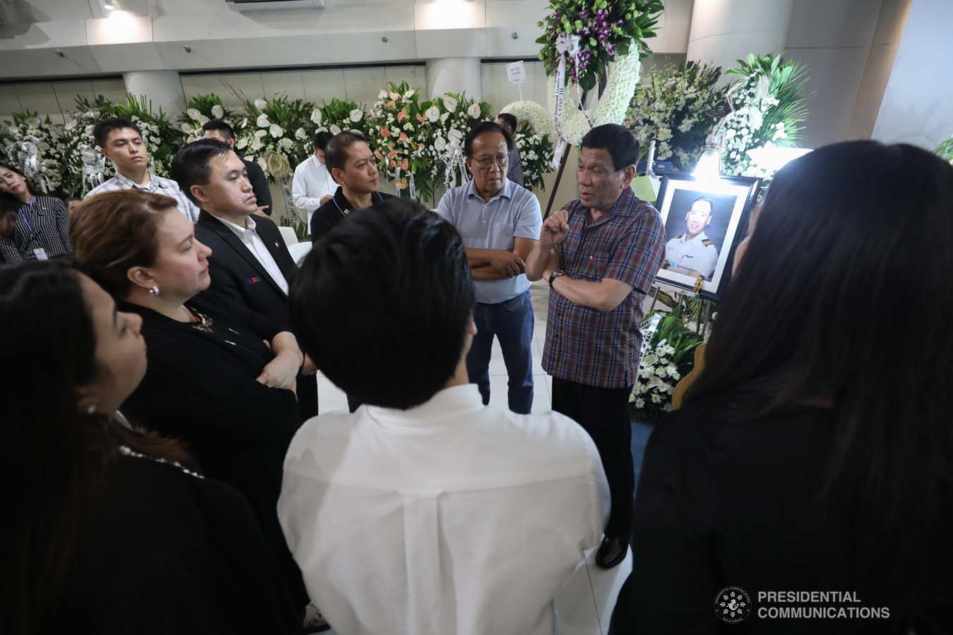 President Rodrigo Roa Duterte commiserates with the family of the late First Officer Lino Cruz III as he visits the wake at the Loyola Memorial Park in Parañaque City on September 5, 2019. Cruz was the co-pilot of the Beechcraft King Air 350 with registry number RP-C2296 that crashed in Calamba City, Laguna last September 1. ACE MORANDANTE/PRESIDENTIAL PHOTO