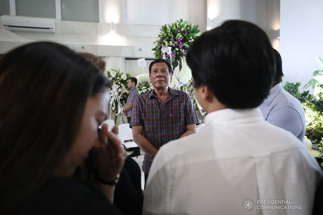 President Rodrigo Roa Duterte commiserates with the family of the late First Officer Lino Cruz III as he visits the wake at the Loyola Memorial Park in Parañaque City on September 5, 2019. Cruz was the co-pilot of the Beechcraft King Air 350 with registry number RP-C2296 that crashed in Calamba City, Laguna last September 1. ACE MORANDANTE/PRESIDENTIAL PHOTO