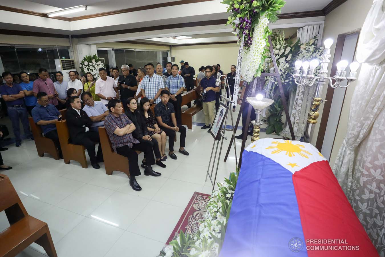 President Rodrigo Roa Duterte pays his last respects to Captain Jesus Hernandez as he visits the wake at the Loyola Memorial Park in Parañaque City on September 5, 2019. Hernandez was the pilot of the Beechcraft King Air 350 with registry number RP-C2296 that crashed in Calamba City, Laguna last September 1. SIMEON CELI JR./PRESIDENTIAL PHOTO